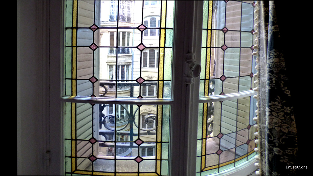 restoration geometric stained glass window haussmann apartment flat paris